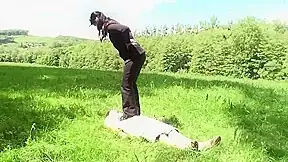 Outdoor trampling punishment with muddy shoes by Femdom Austria