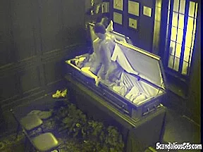Slut fucks in massive coffin