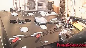 Femdom BDSM latex domina torments sub with cock pump