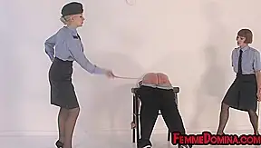 Uniformed whipping femdoms lashing sub ass in 3some